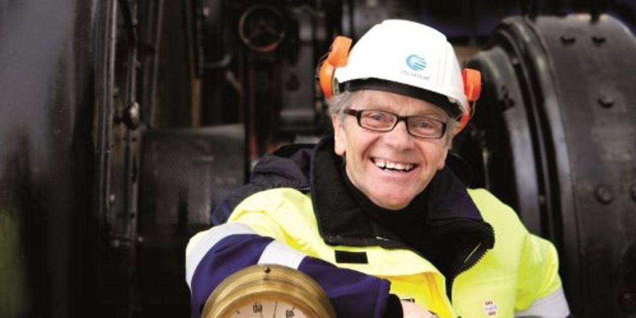 Smiling employee inside power plant